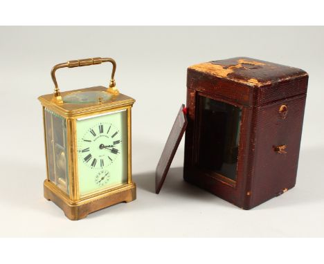 A BRASS CARRIAGE CLOCK, with repeat movement, cream enamel dial, striking on a gong, in a leather case. 13.5cms high.