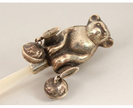 A SILVER AND MOTHER-OF-PEARL TEDDY BEAR BABIES RATTLE.