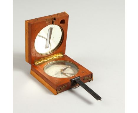 A 19TH CENTURY FRENCH MAHOGANY AND BOXWOOD FOLDING COMPASS. 9cms wide (closed).