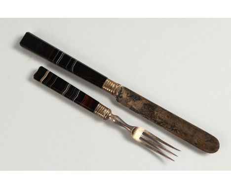 AN EARLY BANDED AGATE HANDLED KNIFE AND FORK. 21cms x 15cms long.