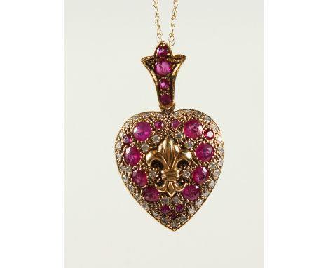 A GOOD 9CT GOLD, RUBY AND DIAMOND HEART SHAPED LOCKET on chain.