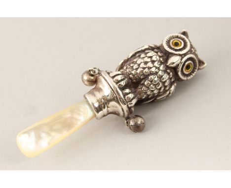 A SILVER AND MOTHER-OF-PEARL OWL BABIES RATTLE.