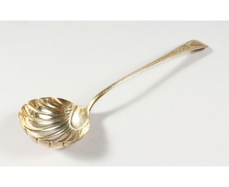 A GEORGE III BRIGHT CUT LADLE, with shell bowl. London 1786.