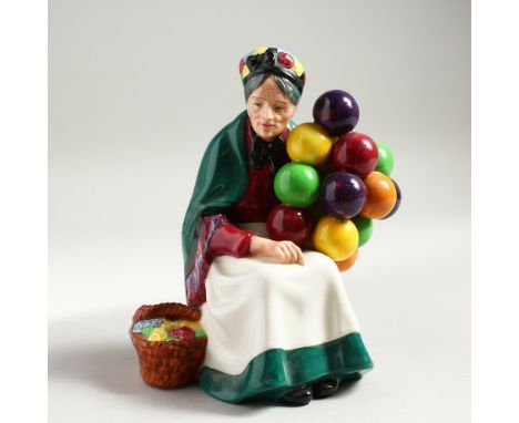A ROYAL DOULTON FIGURE 'THE OLD BALLOON SELLER', No. HN1315, Designed by L. Harradine, First Issued 1929. 7.5ins high.