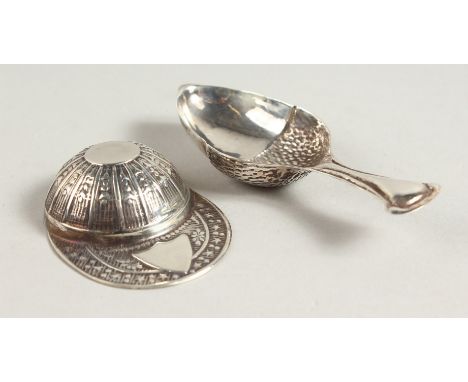 A NOVELTY SILVER JOCKEY CAP CADDY SPOON and A SPOON (2).