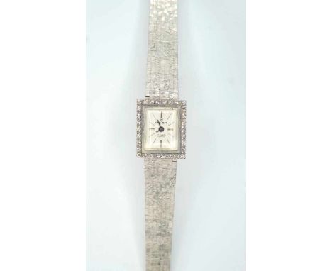   Onsa, Damenuhr  14 K Weißgold. Armband mit Feiloptik, Ziffernblatt flankiert mit Diamanten. Gangbar. L ca. 18,5 cm, Gewicht