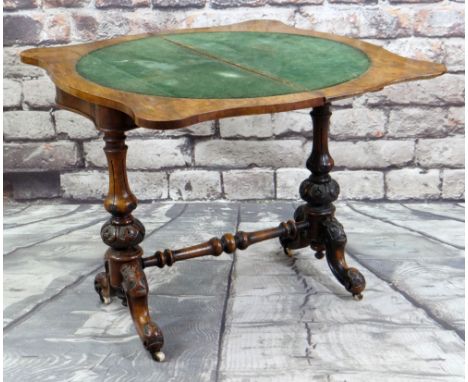 MID-VICTORIAN BURR WALNUT FOLDOVER CARD TABLE, the serpentine top internally inlaid in velvet, on carved baluster legs united