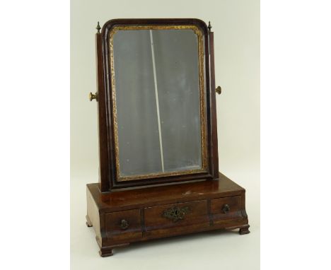 GEORGE III-STYLE MAHOGANY BOX BASE DRESSING TABLE MIRROR, reeded swing frame with gilded slip, three base drawers, bracket fe