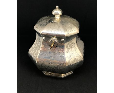 An early Victorian octangular chased gothic design silver tea caddy, with lock and key by Charles Reily & George Storer, Lond