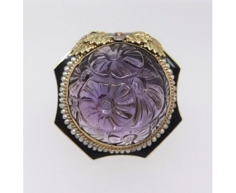 An impressive 14ct large carved amethyst and enamel ring set in yellow gold with a pearl border, ring size P, diameter of set
