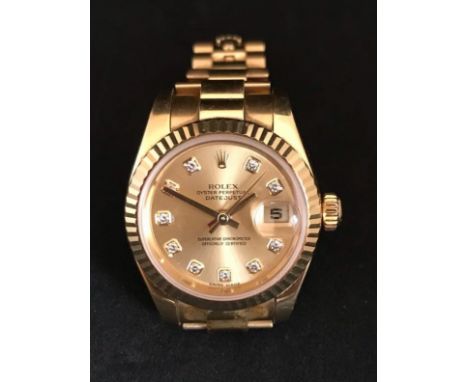 Rolex, a fine ladies 18ct gold Datejust Chronometer wristwatch with champagne diamond dot dial, President concealed bracelet,