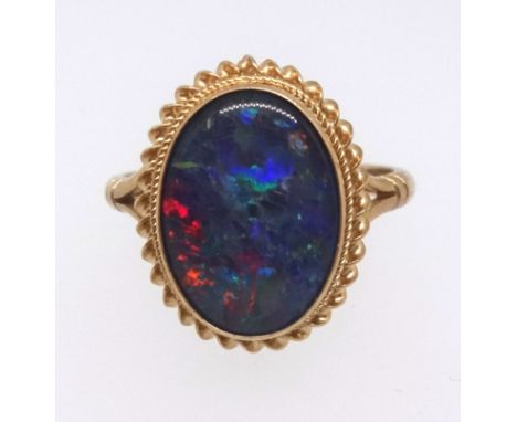 An 9ct opal oval cut ring, ring size O.