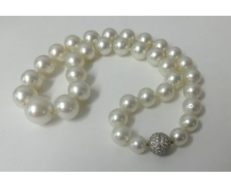 A South Sea pearl necklace, graduating in size, measuring approx. 46cm length. The silver/white pearls of good lustre ,rangin