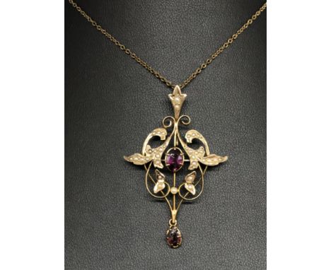 An Art Nouveau style 9ct amethyst and seed pearl pendant.