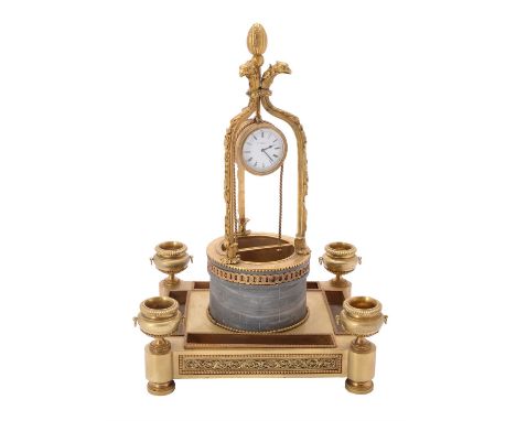 An unusual gilt metal and marble "water well" timepiece, 19th century, with an eight-day movement and white enamel dial inscr