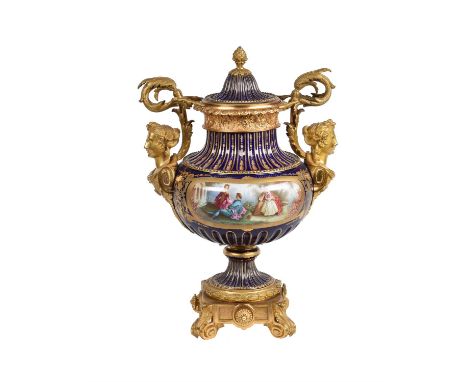 A French porcelain and gilt metal mounted urn and cover in Sevres style, late 19th century, the body mounted with twin caryat