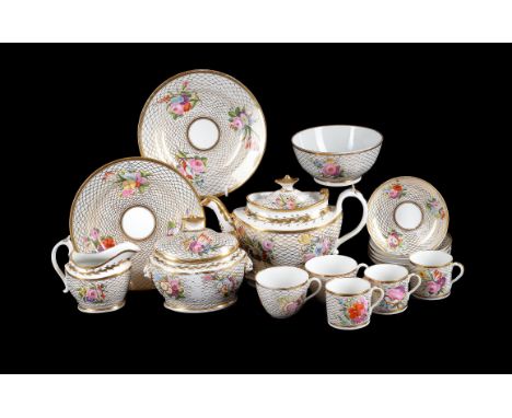 An English porcelain 'Bute' shape part tea service, early 19th century, painted with flowers reserved on a gilt trellis groun