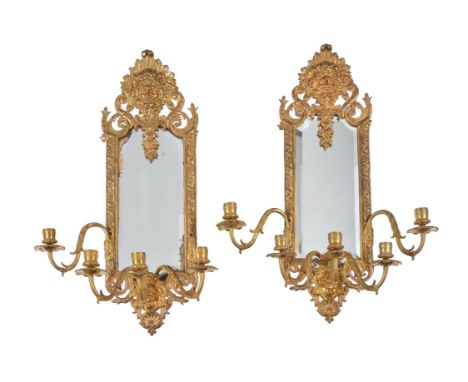 A pair of French gilt metal five light girandoles, second half 19th century, each ribbon-and-stave cast frame with a central 