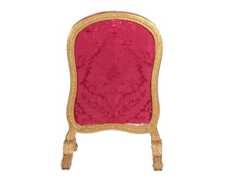 A giltwood firescreen in Louis XVI style, late 19th century, with a shaped red floral panel above supports and scroll feet, 1