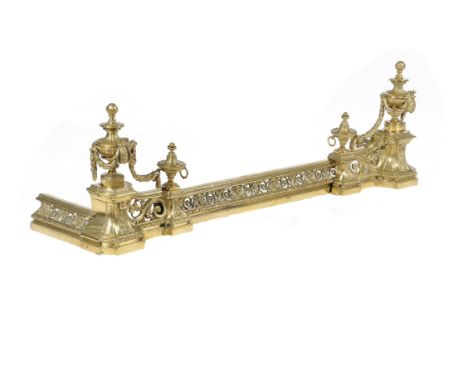 A brass fire fender in Louis XVI style, each end cast with a festooned urn, flanking the adjustable pierced centre, approxima