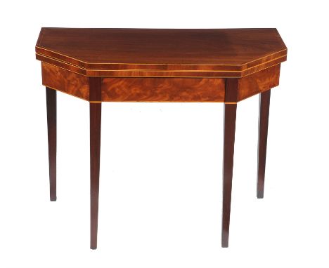 A George III mahogany and boxwood strung card table, circa 1790, of canted rectangular outline, the hinged top enclosing baiz