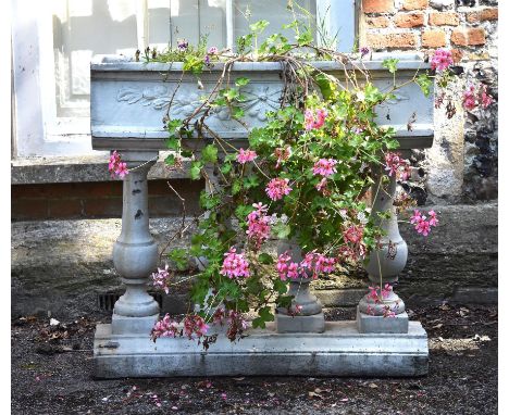 A white painted reconstituted stone planter in the 17th century taste, modern, the rectangular basin with vine motif and rais