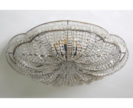 A large Continental cut glass ceiling light, second quarter 20th century, of quatrefoil outline, inset with pendants and swag