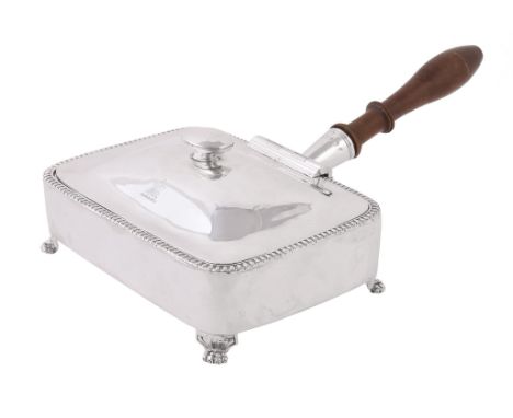 A George IV Irish silver rounded rectangular toasted cheese dish by Stephen Bergin, Dublin 1821, with a screw-out turned wood