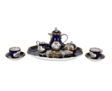 A Meissen ornithological blue-ground and gilt porcelain tête-à-tête coffee service, late 19th century, Comprising tray, two c