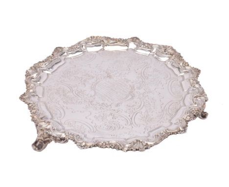 A William IV silver shaped circular salver by Henry Wilkinson & Co., Sheffield 1833, with a raised shell, scroll and flower c