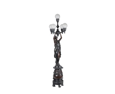 A large bronzed spelter figural lamp, modern in the late 19th century French style, in the form of a female figure upholding 