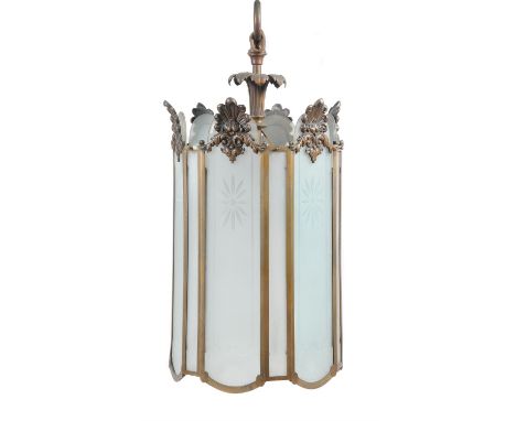A George III style brass hanging lantern, elements 19th century and later, with frosted glazed panels headed by anthemia, of 