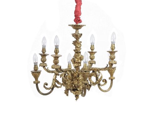 A French gilt metal eight light chandelier in Louis XVI style, second quarter 20th century, the stem and circlet cast with fr