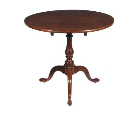 A George III mahogany tripod table , circa 1760, the circular top above a turned column and outswept legs, 73cm high, 85cm wi