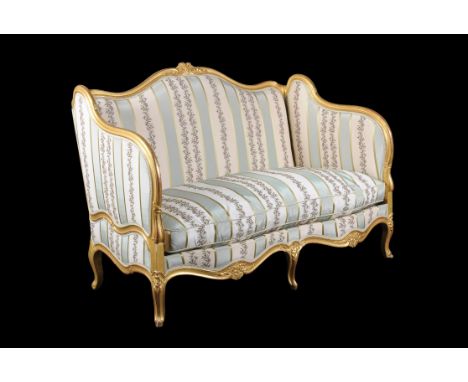 A French carved giltwood sofa in Louis XV style, late 19th century, upholstered with a pale-blue and white striped fabric, 11