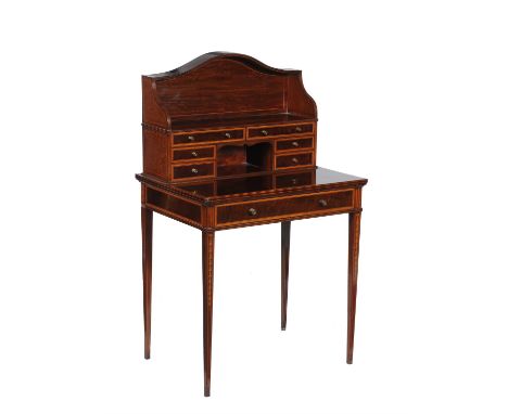 An Edwardian mahogany, satinwood crossbanded, and inlaid Bonheur du jour in George III style, circa 1905, the superstructure 