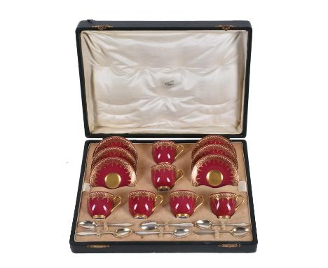 A Royal Worcester claret-ground and gilt coffee service for six, in a fitted case with silver spoons, date codes for 1925, th
