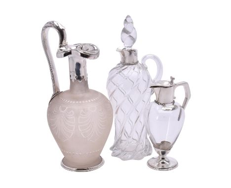 A Victorian silver mounted glass oinochoe shape ewer by George Fox, London 1865, with a leaf-capped high handle terminating w
