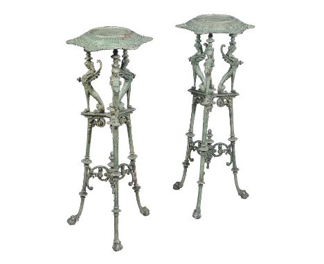 A pair of French cast iron and green enamel low torcheres in early 19th Century style, 20th century, each with circular dish 
