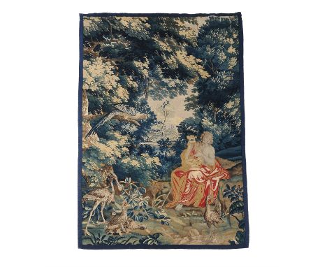 An Aubusson verdure tapestry with Orpheus enchanting the animals, early 18th century, the draped male figure portrayed playin