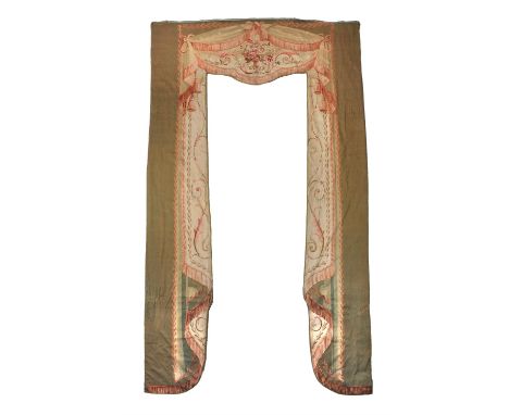 A late 19th century Aubusson tapestry window surround, woven throughout with trompe l'oeil drapery and swags with floral surm
