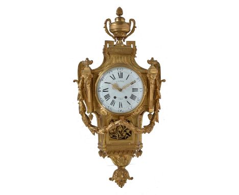 A Louis XVI style gilt brass cartel clock, retailed by E. White, London, late 19th century, after a design by Jean-Charles De