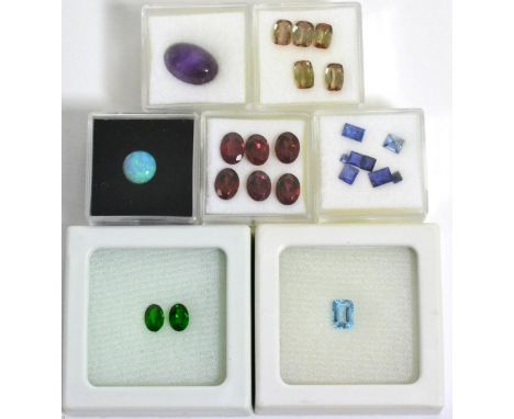 A Quantity of Loose Gemstones, including, a cabachon amethyst, an opal, an aquamarine, two chrome diopside, five andalusite, 