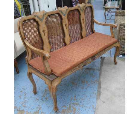 SETTEE, Queen Anne style with a caned back in a distressed painted finish solid seat and patterned squab cushion, 130cm W x 4