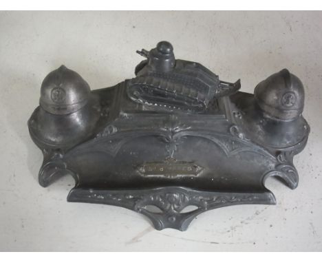 A French spelter desk stand commemorating The Battle of Ypres with tank to centre and helmet inkstand's - Width 20cm Conditio