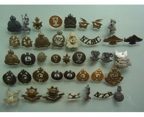 An uncommon collection of 40 New Zealand Army original badges, including 3rd, 6th, 7th, 8th, 10th, 11th, 12th, 14th, 15th Reg