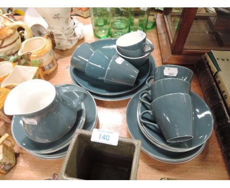 A vintage part tea service by Poole in two tone teal and cream