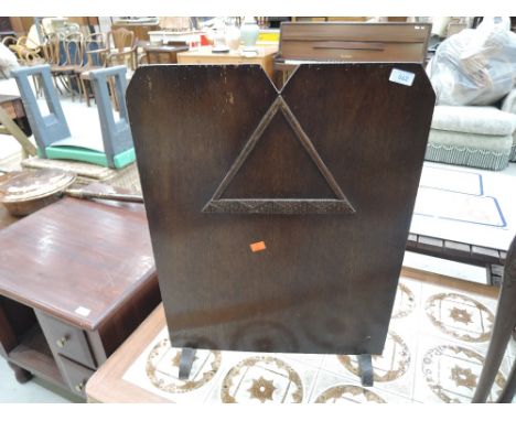 A traditional oak firescreen