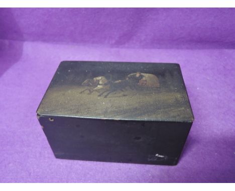 A vintage lacquered tea caddy with hand painted oil top depicting Russian winter sledge scene 