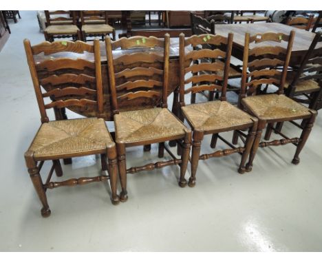 A set of 4 traditional rush seated ladder back chairs